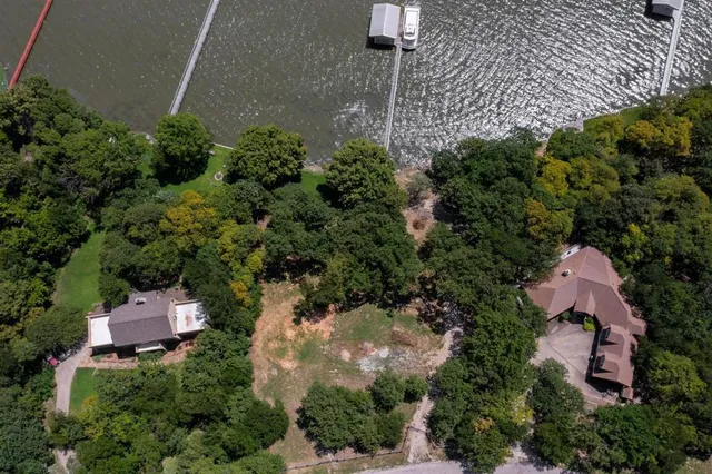 an aerial view of a house with outdoor space and street view