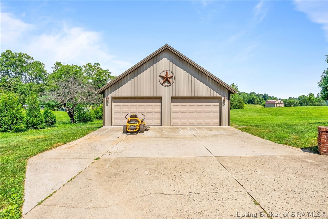 8440 Pekin Road Greenville, IN 47124 - Photo 2 of 49 Garage has electric and there is a fenced area behind.