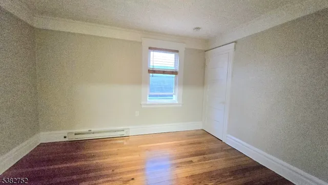 a bathroom with a toilet a sink and a window
