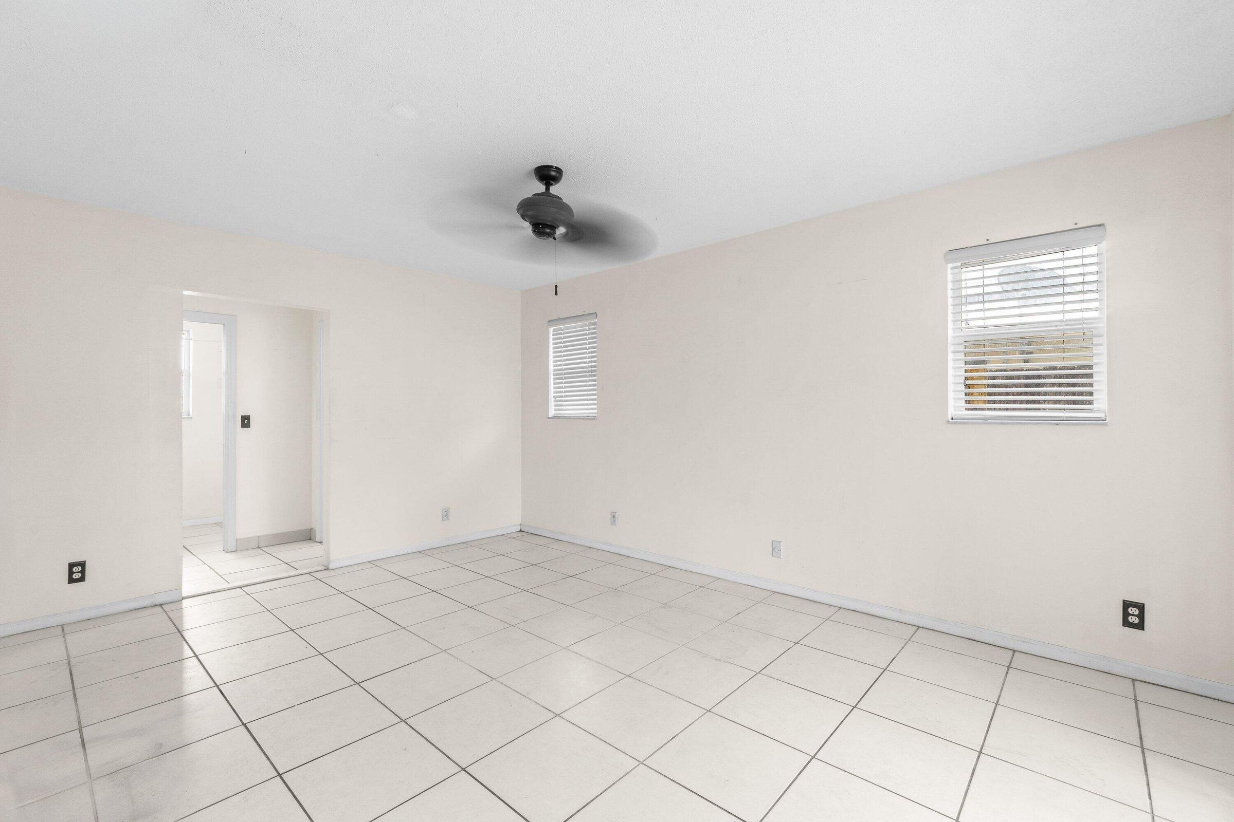 921 Southwest 11th Terrace Boca Raton, FL 33486 - Photo 17 of 26 a view of an empty room with a window