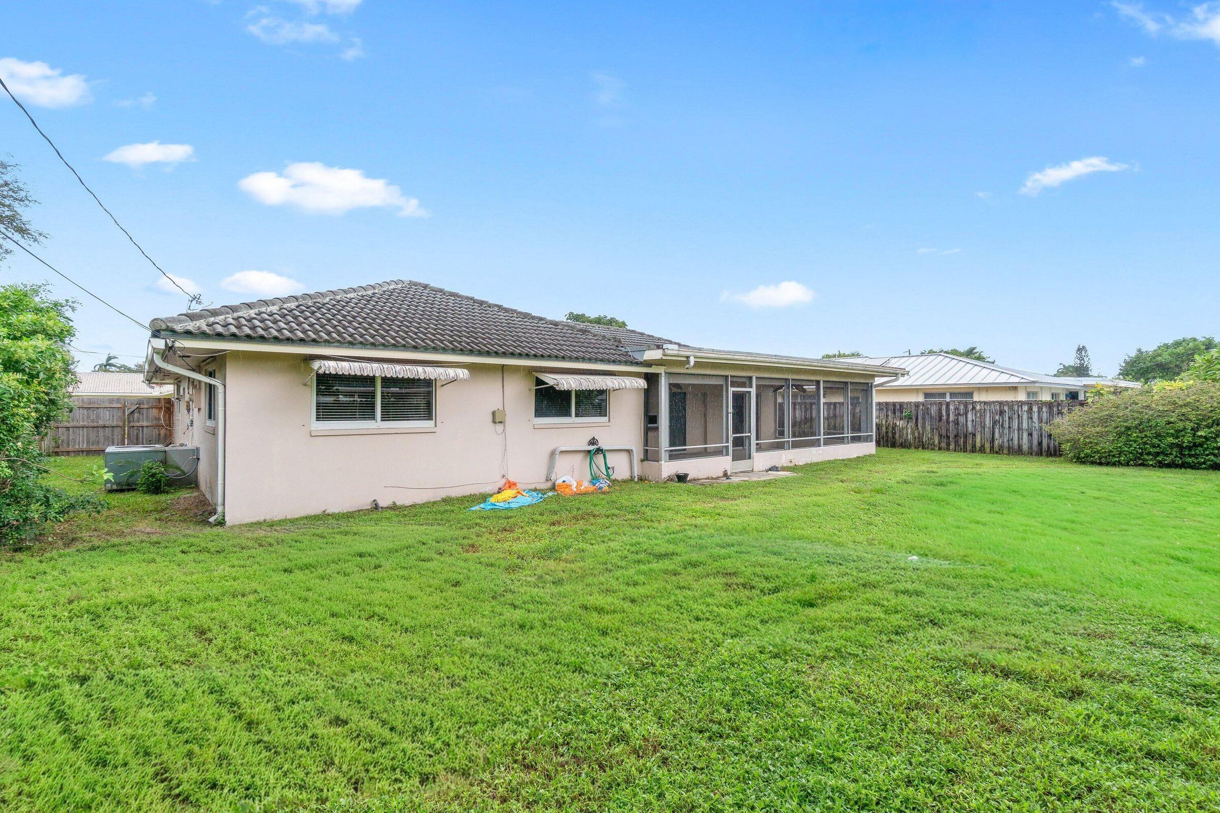 921 Southwest 11th Terrace Boca Raton, FL 33486 - Photo 23 of 26 a view of a house with backyard