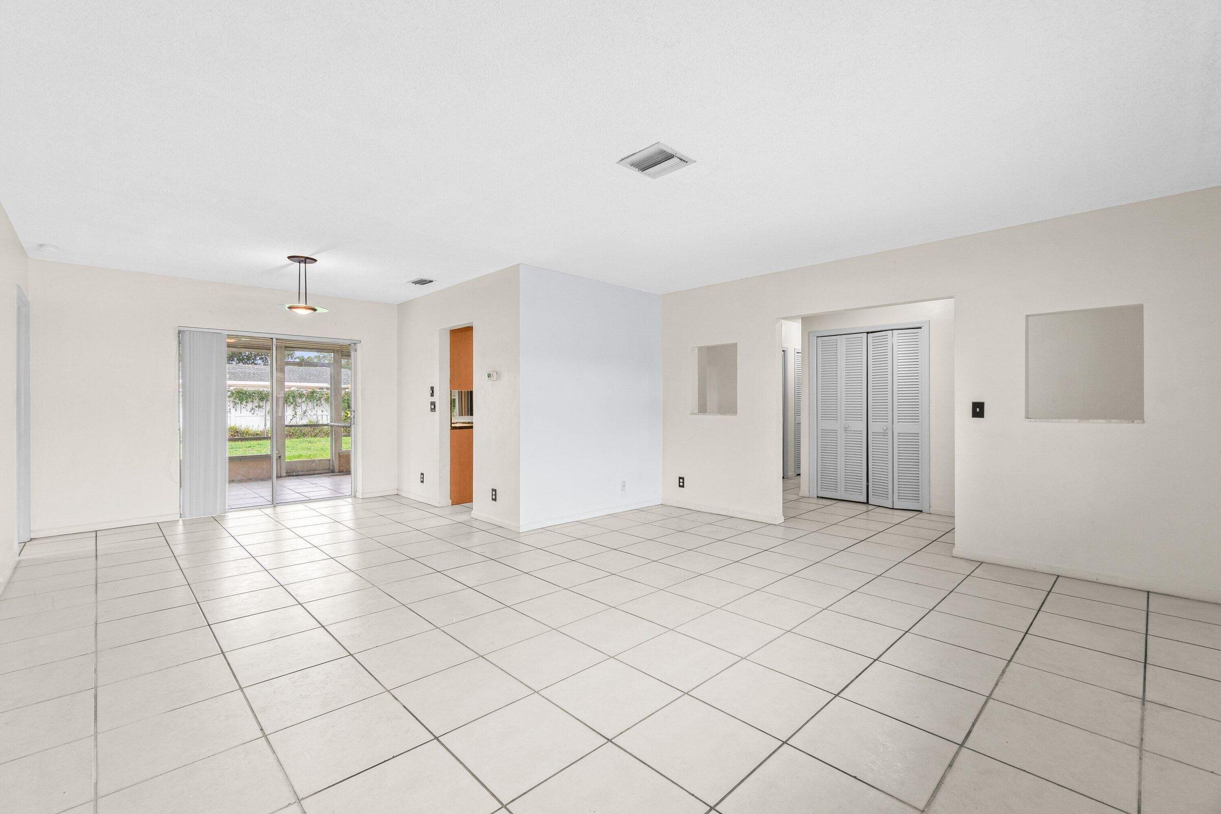 921 Southwest 11th Terrace Boca Raton, FL 33486 - Photo 8 of 26 a view of an empty room and window