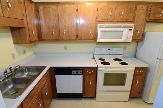 a kitchen with a stove and a sink