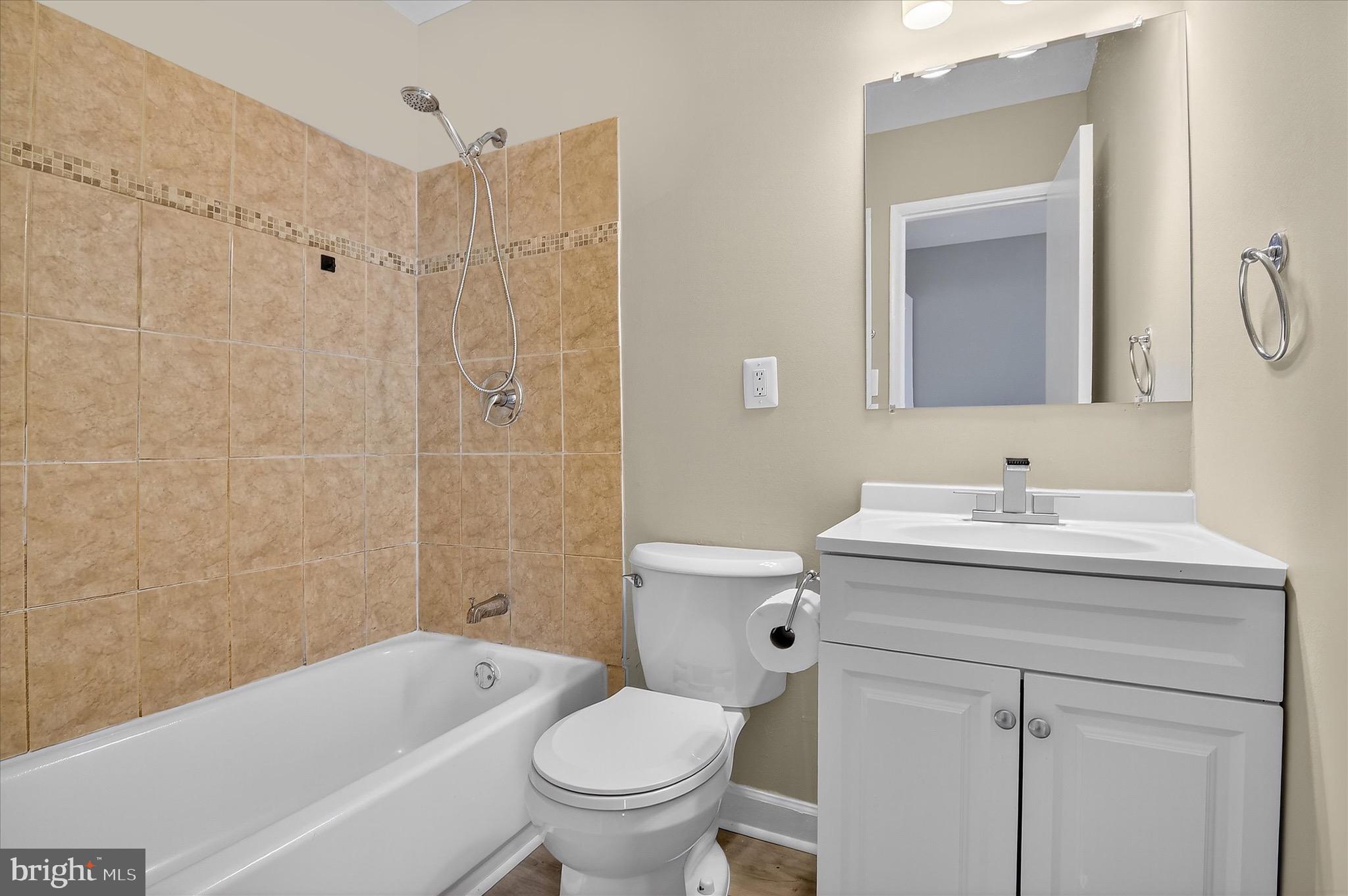402 Reneau Way Herndon, VA 20170 - Photo 19 of 31 a bathroom with a granite countertop sink toilet and shower