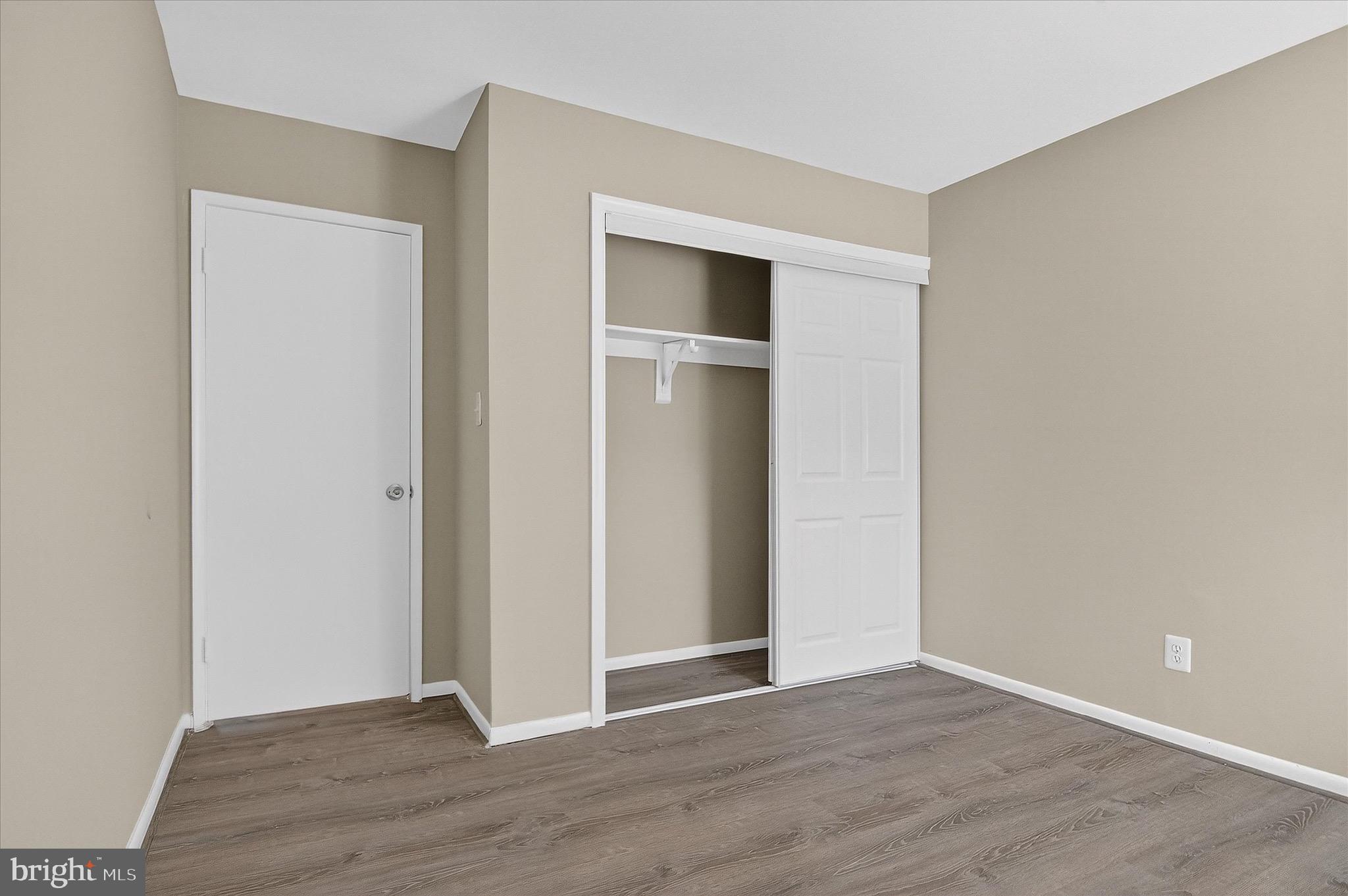 402 Reneau Way Herndon, VA 20170 - Photo 26 of 31 a view of an empty room with wooden floor and closet