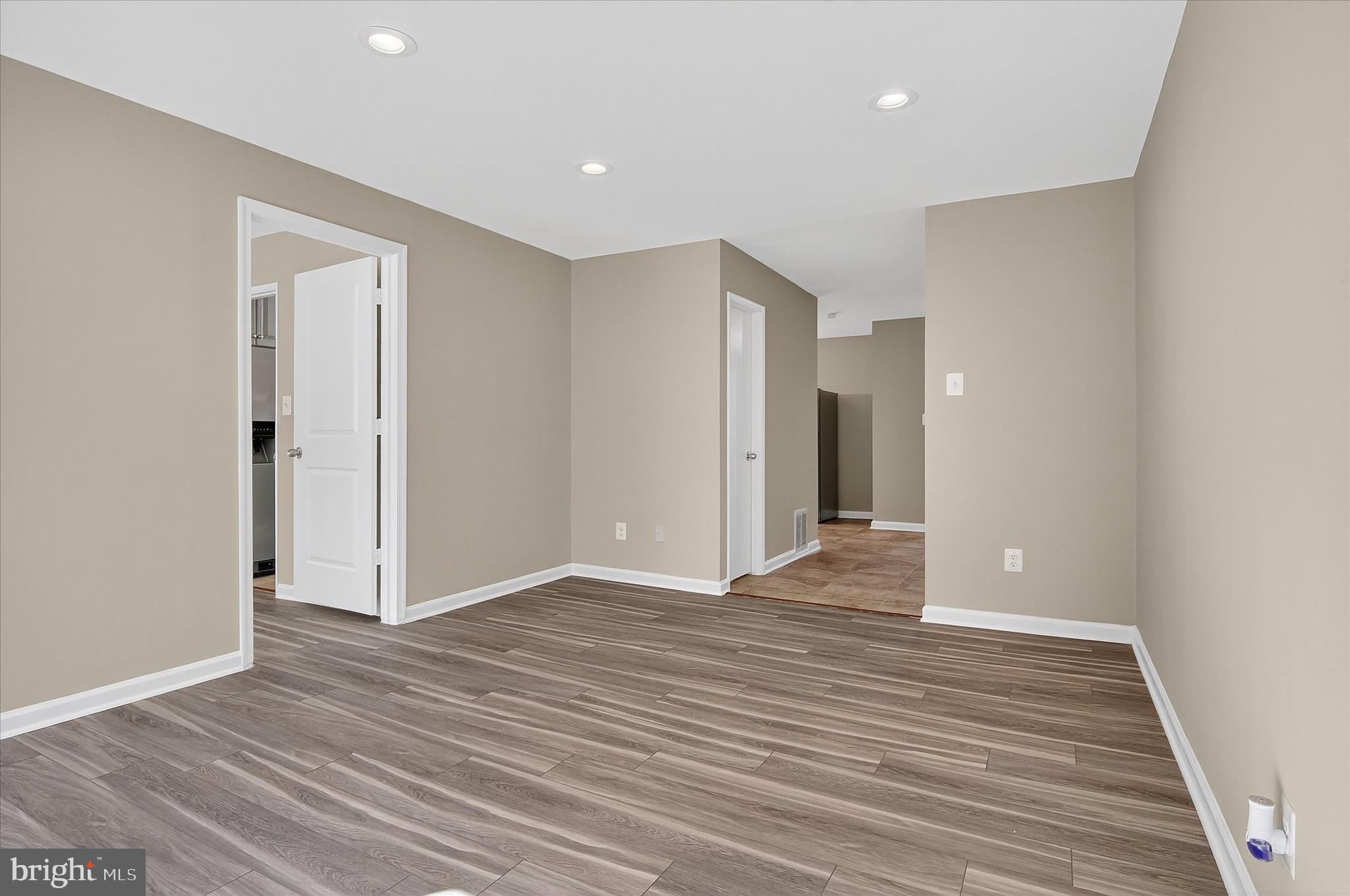 402 Reneau Way Herndon, VA 20170 - Photo 7 of 31 a view of an empty room with wooden floor and closet