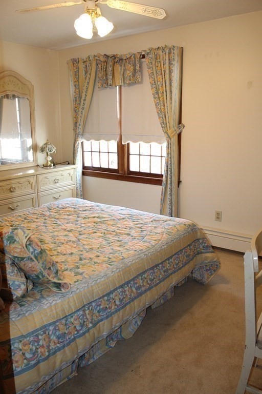 5 Lower Road Hudson, MA 01749 - Photo 13 of 30 a bed sitting in a room next to a window