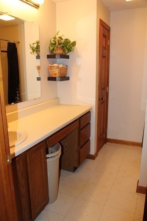 5 Lower Road Hudson, MA 01749 - Photo 20 of 30 a kitchen with a sink and a refrigerator