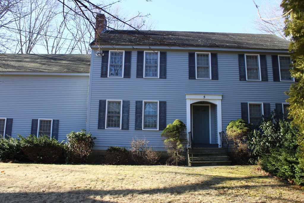 5 Lower Road Hudson, MA 01749 - Photo 2 of 30 a view of a brick house with plants and large windows