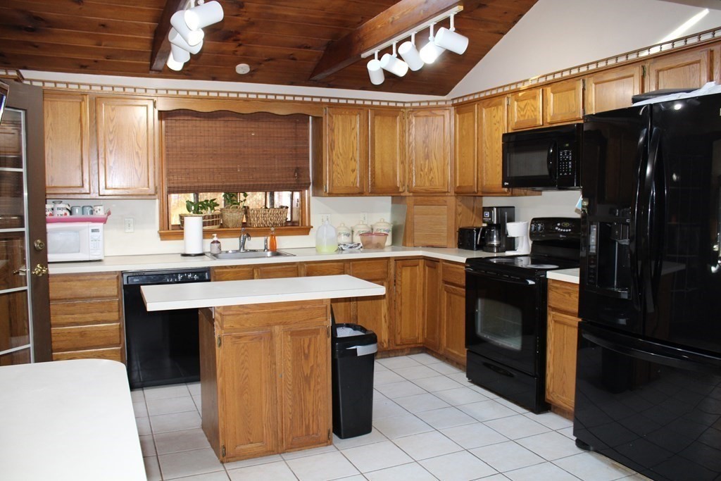 5 Lower Road Hudson, MA 01749 - Photo 3 of 30 a kitchen with stainless steel appliances a stove a sink and a refrigerator