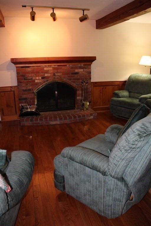 5 Lower Road Hudson, MA 01749 - Photo 7 of 30 a living room with furniture and a fireplace
