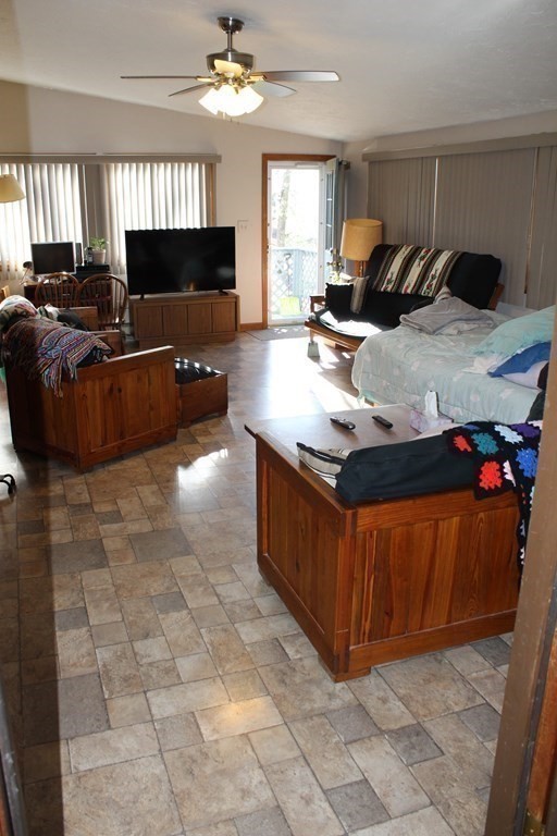 5 Lower Road Hudson, MA 01749 - Photo 9 of 30 a living room with furniture and a flat screen tv