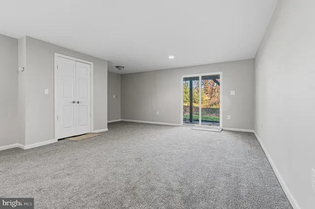 a white toilet sitting next to a shower