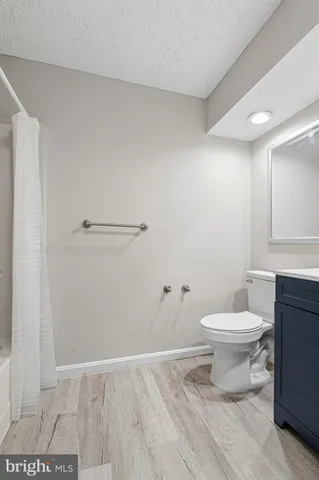 a view of deck with a large window and wooden floor