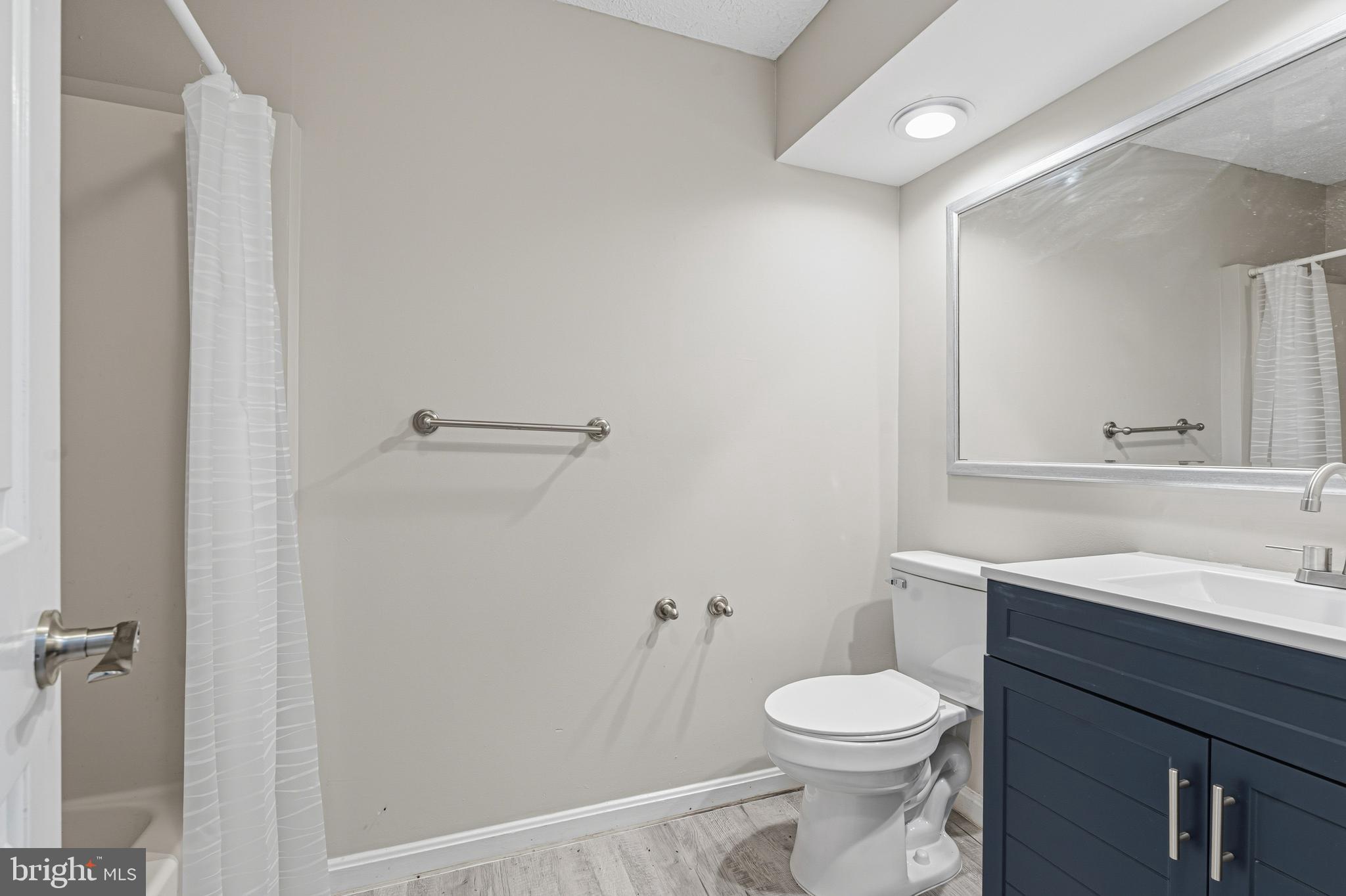 3365 Cheverly Court, Unit 3365 Abingdon, MD 21009 - Photo 25 of 32 a bathroom with a sink a toilet and a mirror