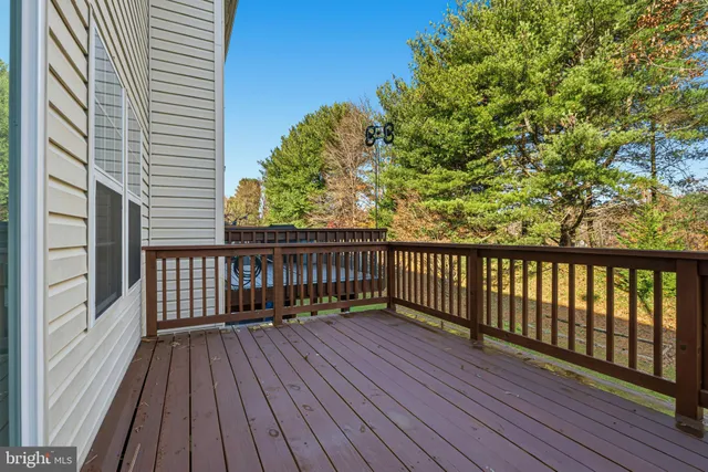 a view of deck with wooden floor and fence