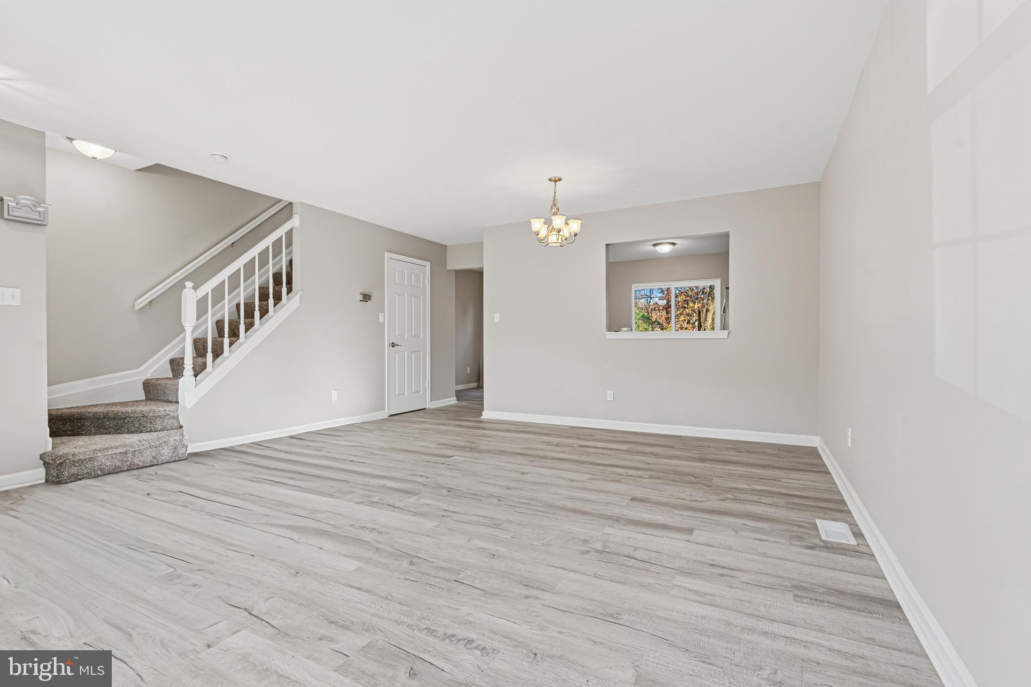 3365 Cheverly Court, Unit 3365 Abingdon, MD 21009 - Photo 5 of 32 a view of an empty room with wooden floor and staircase