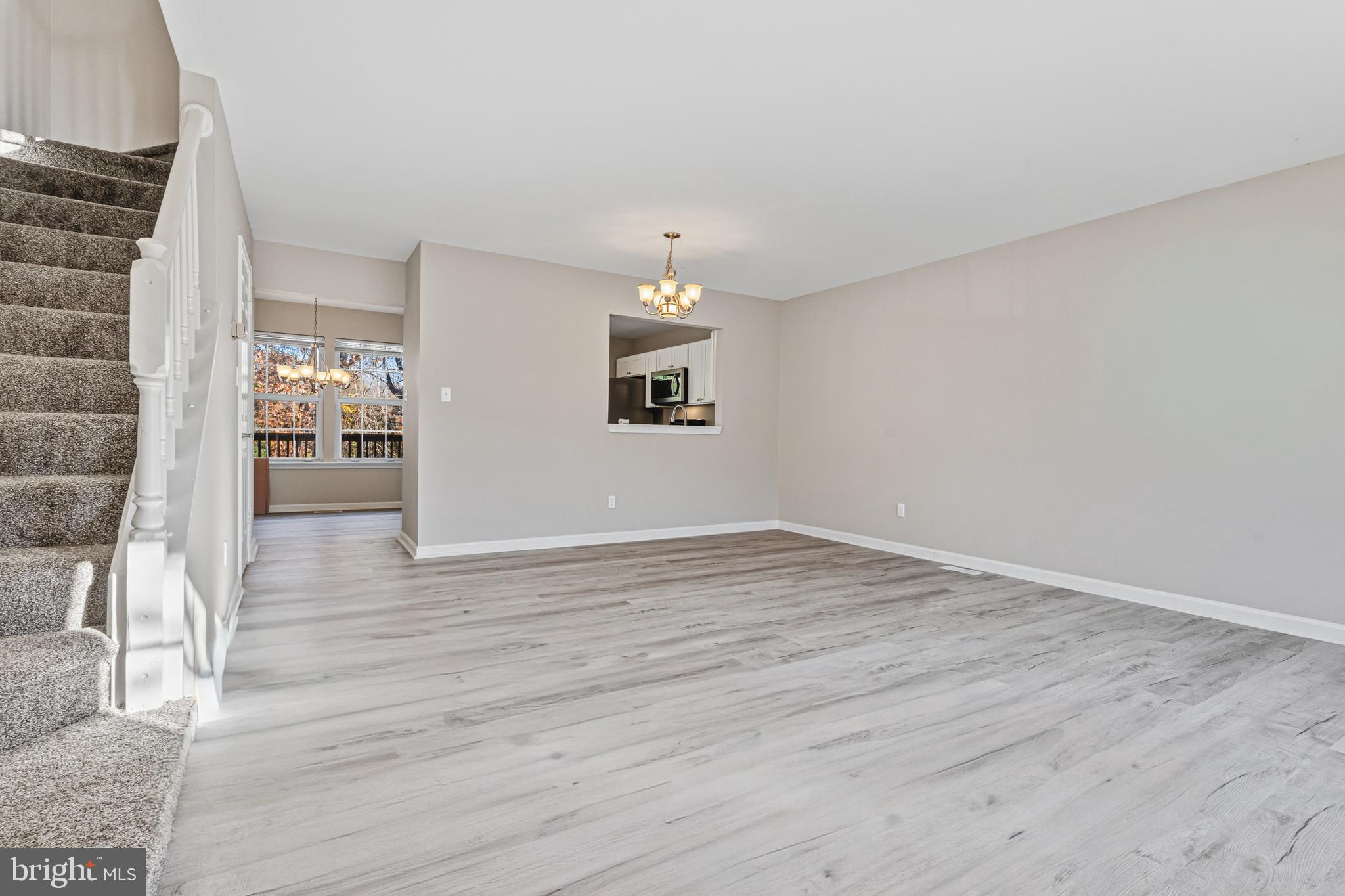 3365 Cheverly Court, Unit 3365 Abingdon, MD 21009 - Photo 7 of 32 a view of an empty room with wooden floor and a window