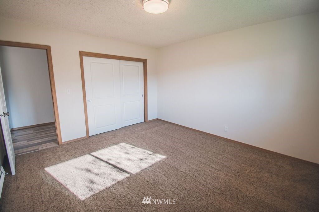 8414 183rd Avenue Southwest Rochester, WA 98579 - Photo 12 of 19 an empty room with a workbench