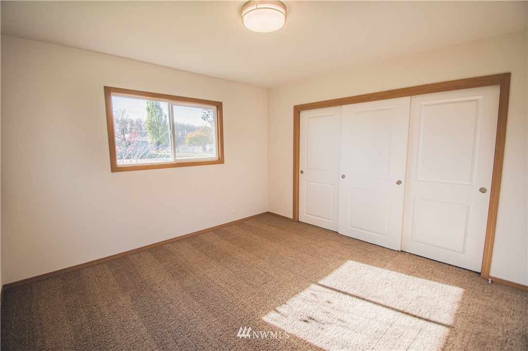 8414 183rd Avenue Southwest Rochester, WA 98579 - Photo 14 of 19 an empty room with windows