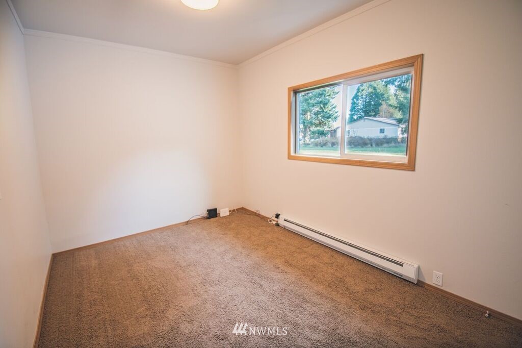 8414 183rd Avenue Southwest Rochester, WA 98579 - Photo 15 of 19 an empty room with a window