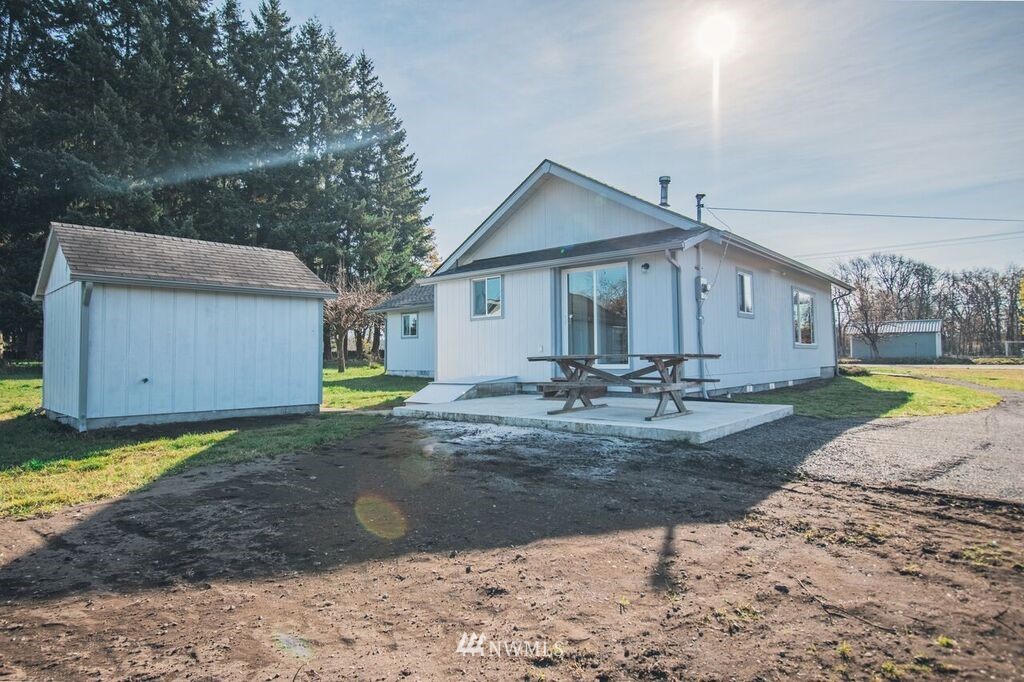 8414 183rd Avenue Southwest Rochester, WA 98579 - Photo 18 of 19 a view of a house with backyard and trees