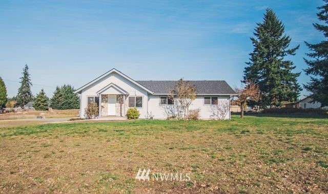 8414 183rd Avenue Southwest Rochester, WA 98579 - Photo 3 of 19 a big house with a big yard and large trees
