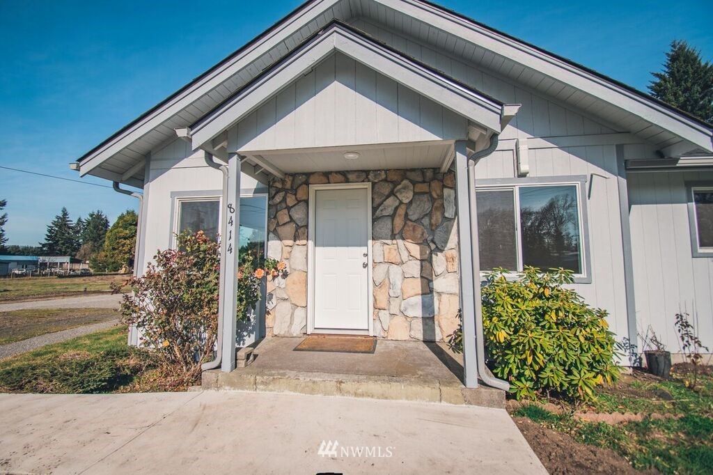 8414 183rd Avenue Southwest Rochester, WA 98579 - Photo 4 of 19 a front view of a house with garden