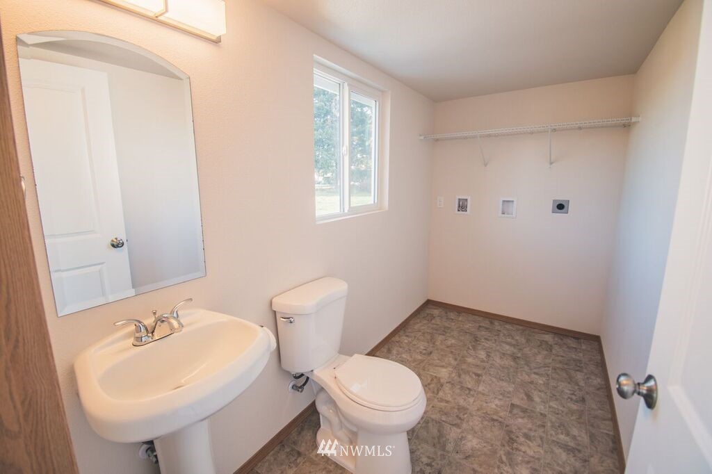 8414 183rd Avenue Southwest Rochester, WA 98579 - Photo 10 of 19 a bathroom with a sink toilet and mirror