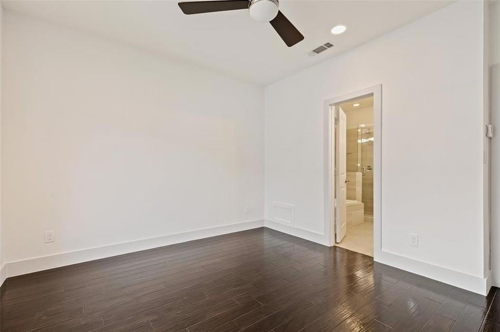 5924 Hudson Street, Unit F Dallas, TX 75206 - Photo 16 of 25 an empty room with wooden floor and natural light