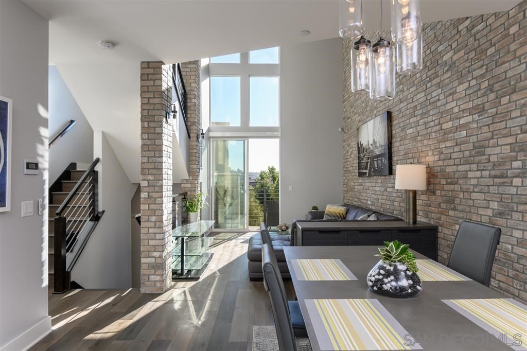 7767 Stylus Drive San Diego, CA 92108 - Photo 1 of 1 a living room with furniture flowerpot and a chandelier