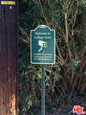a sign broad on the side of the tree