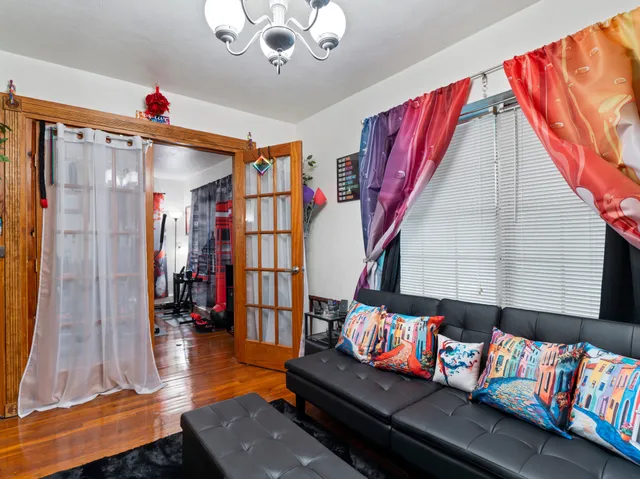 a living room with fireplace furniture and a flat screen tv