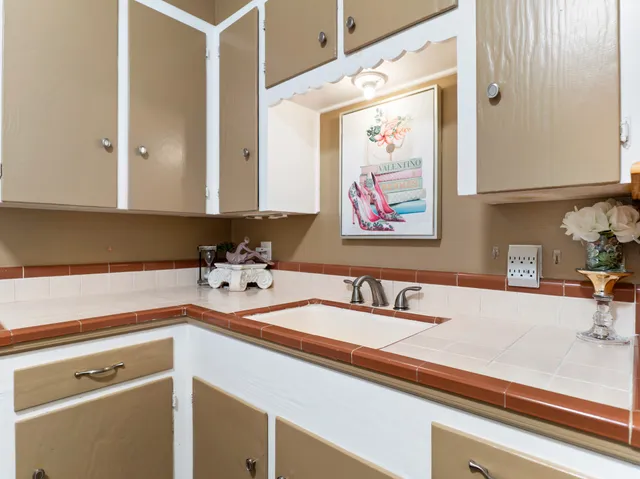 a bedroom with a bed closet and a large window