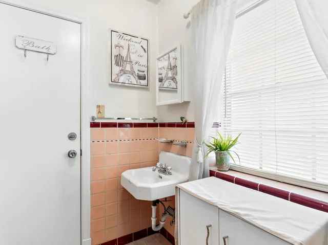 a white toilet sitting next to a bathroom sink