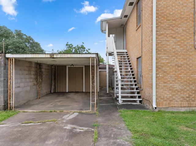 a front view of house with yard and trees
