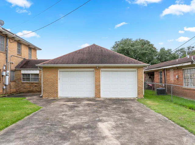 an aerial view of a house with a garden