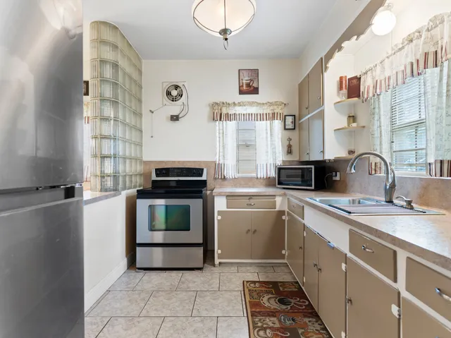 a kitchen with a stove and a sink