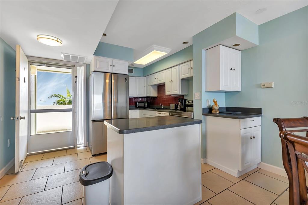 1500 Park Beach Circle, Unit 3B Punta Gorda, FL 33950 - Photo 13 of 57 a kitchen with stainless steel appliances granite countertop a refrigerator sink and stove