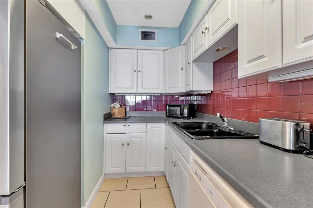 1500 Park Beach Circle, Unit 3B Punta Gorda, FL 33950 - Photo 16 of 57 a kitchen with a sink and cabinets