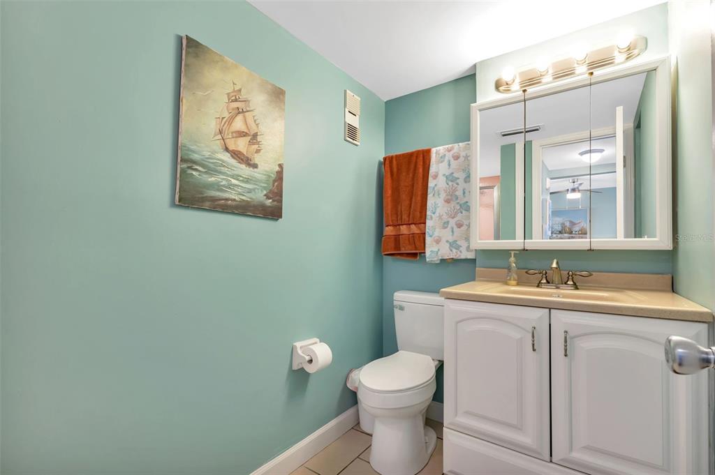 1500 Park Beach Circle, Unit 3B Punta Gorda, FL 33950 - Photo 20 of 57 a bathroom with a toilet sink and mirror