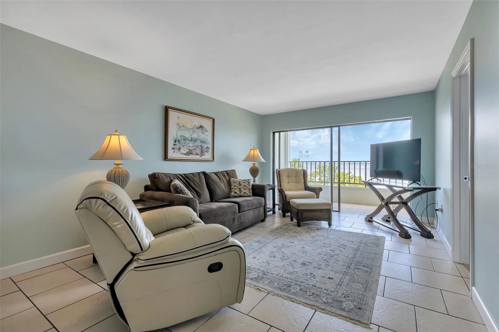 1500 Park Beach Circle, Unit 3B Punta Gorda, FL 33950 - Photo 25 of 57 a living room with furniture and a flat screen tv
