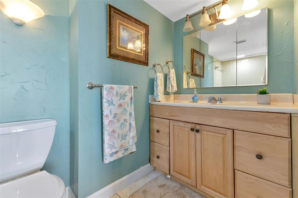 1500 Park Beach Circle, Unit 3B Punta Gorda, FL 33950 - Photo 31 of 57 a bathroom with a toilet a sink and mirror