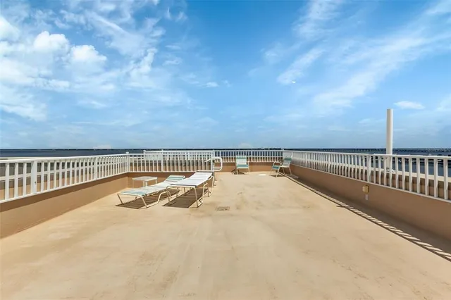 a view of a balcony with wooden floor