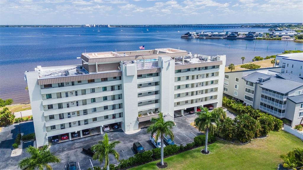 1500 Park Beach Circle, Unit 3B Punta Gorda, FL 33950 - Photo 47 of 57 a front view of a building with lake view and tall buildings