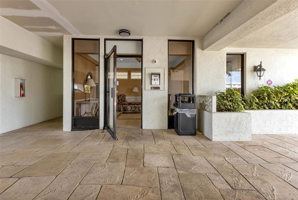 1500 Park Beach Circle, Unit 3B Punta Gorda, FL 33950 - Photo 5 of 57 a view of a entryway with furniture and refrigerator
