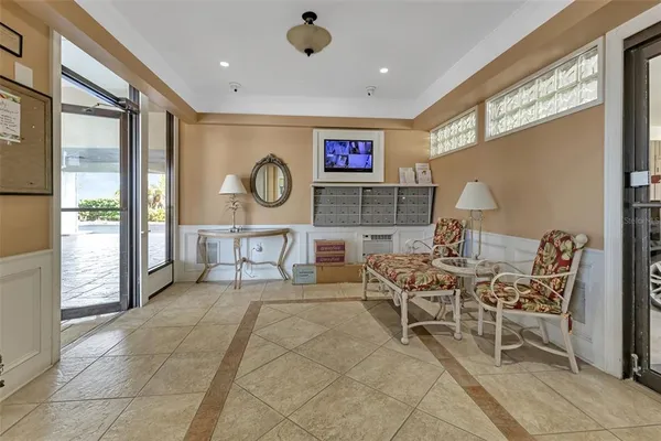 a hallway with dining area and glass windows