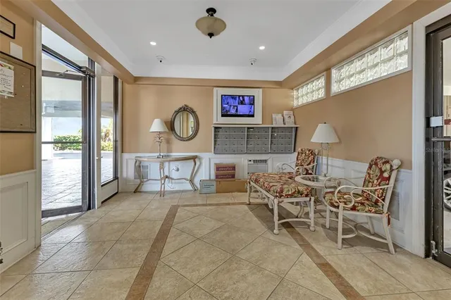 a hallway with dining area and glass windows