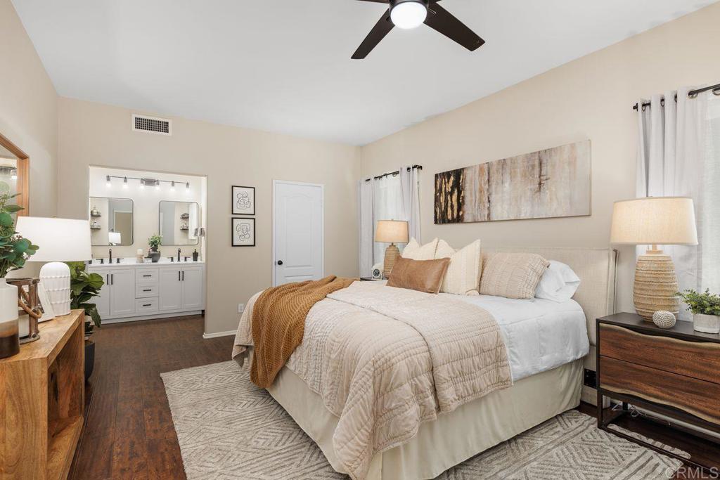 160 Belflora Way Oceanside, CA 92057 - Photo 20 of 41 a bedroom with a bed and lamp