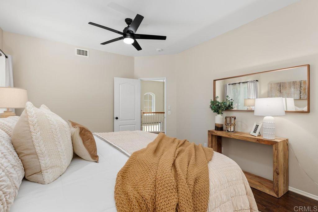 160 Belflora Way Oceanside, CA 92057 - Photo 21 of 41 a bedroom with a bed and a desk